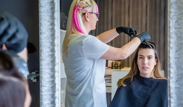 Professional color application on client's hair.