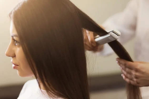 Keratin smoothing treatment being applied.