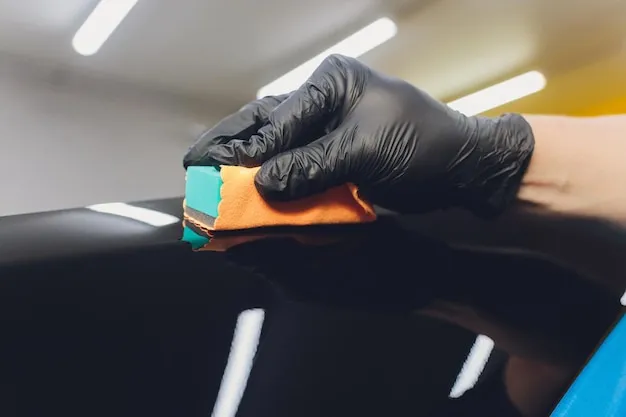 Ceramic coating process on vehicle paint.