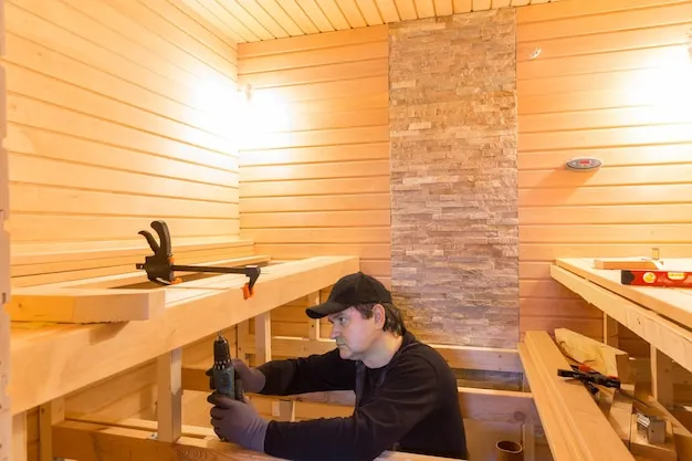 Herramientas y proceso de mantenimiento en interior de sauna.