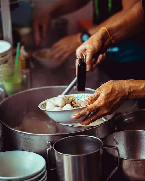 Restaurant El Hondureño II staff in action preparing baleadas and soups in a clean, energetic kitchen environment.