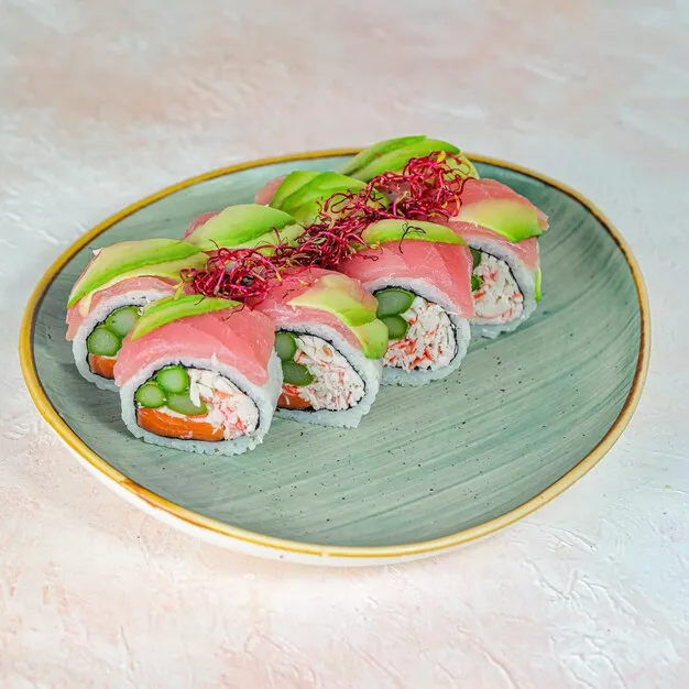 Sliced California roll showcasing fresh fillings.
