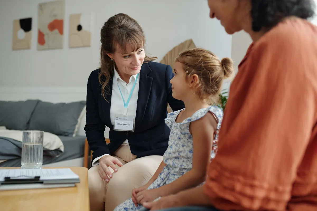 Family law attorney reviewing custody documents with concerned parents.