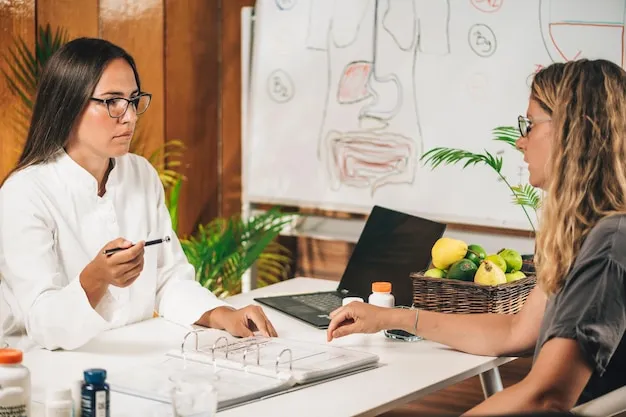 Wellness expert consulting with smiling client over nutrition charts in bright, contemporary office.