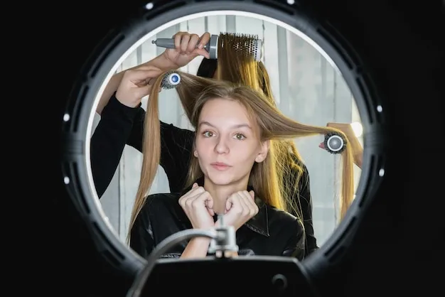 Client enjoying a professional blowout and hair styling session.