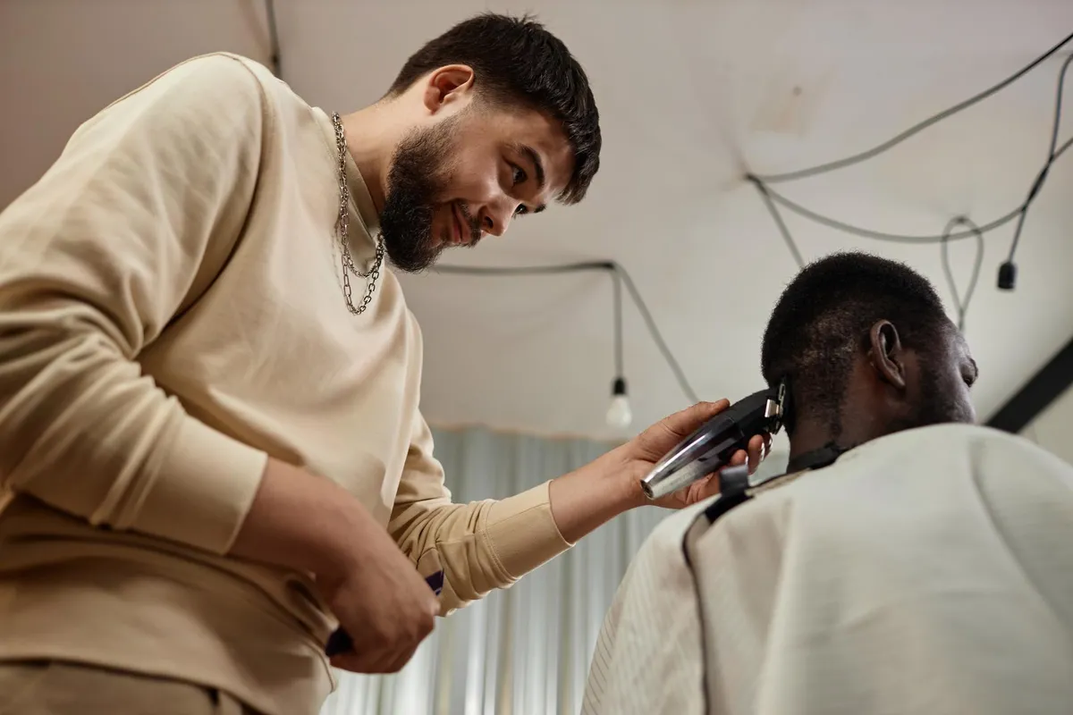 Professional taper cut being styled by barber.