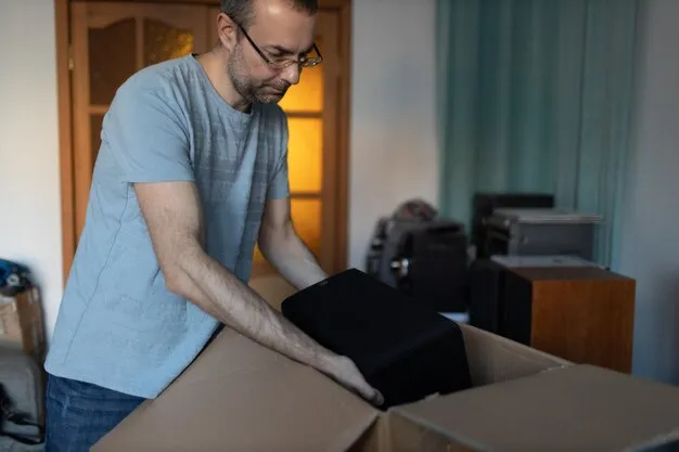 Close-up of packing delicate items securely in a box.