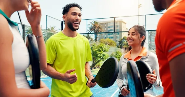 Lively social padel event with players interacting.