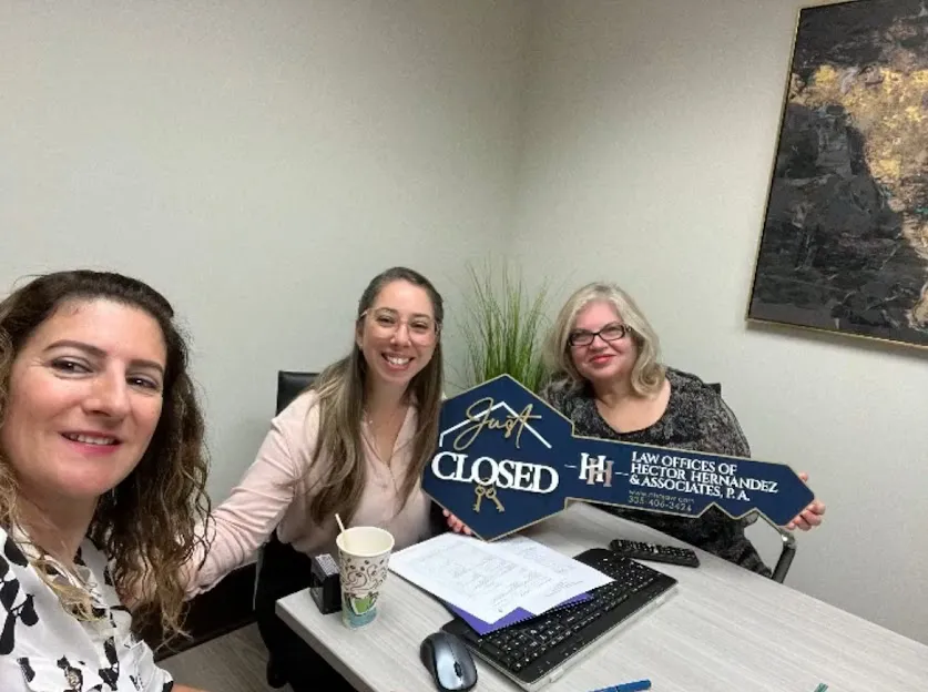 Client celebrating a successful real estate closing with our team