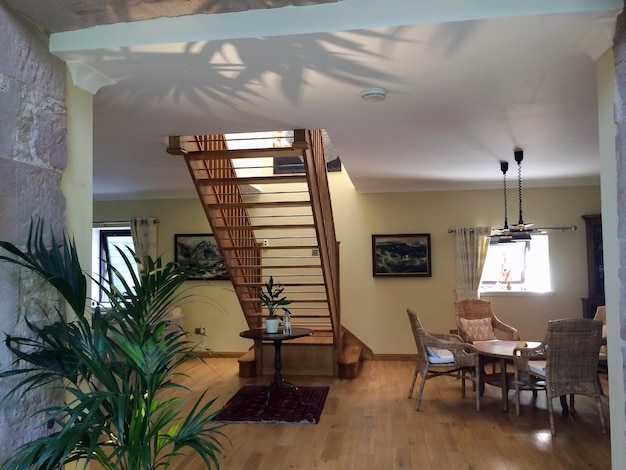 Inverted house exhibit with household items positioned upside down.