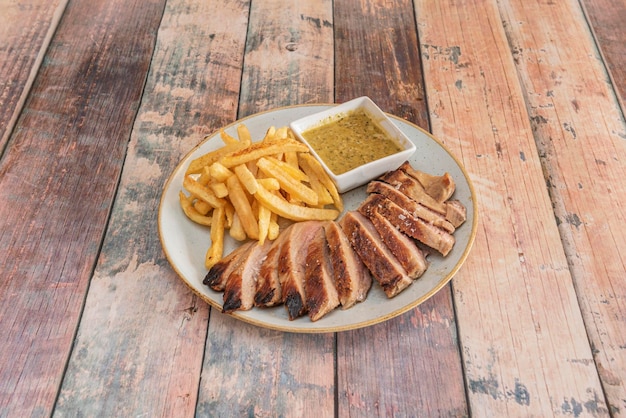 Succulent lechon asado pork with traditional accompaniments.