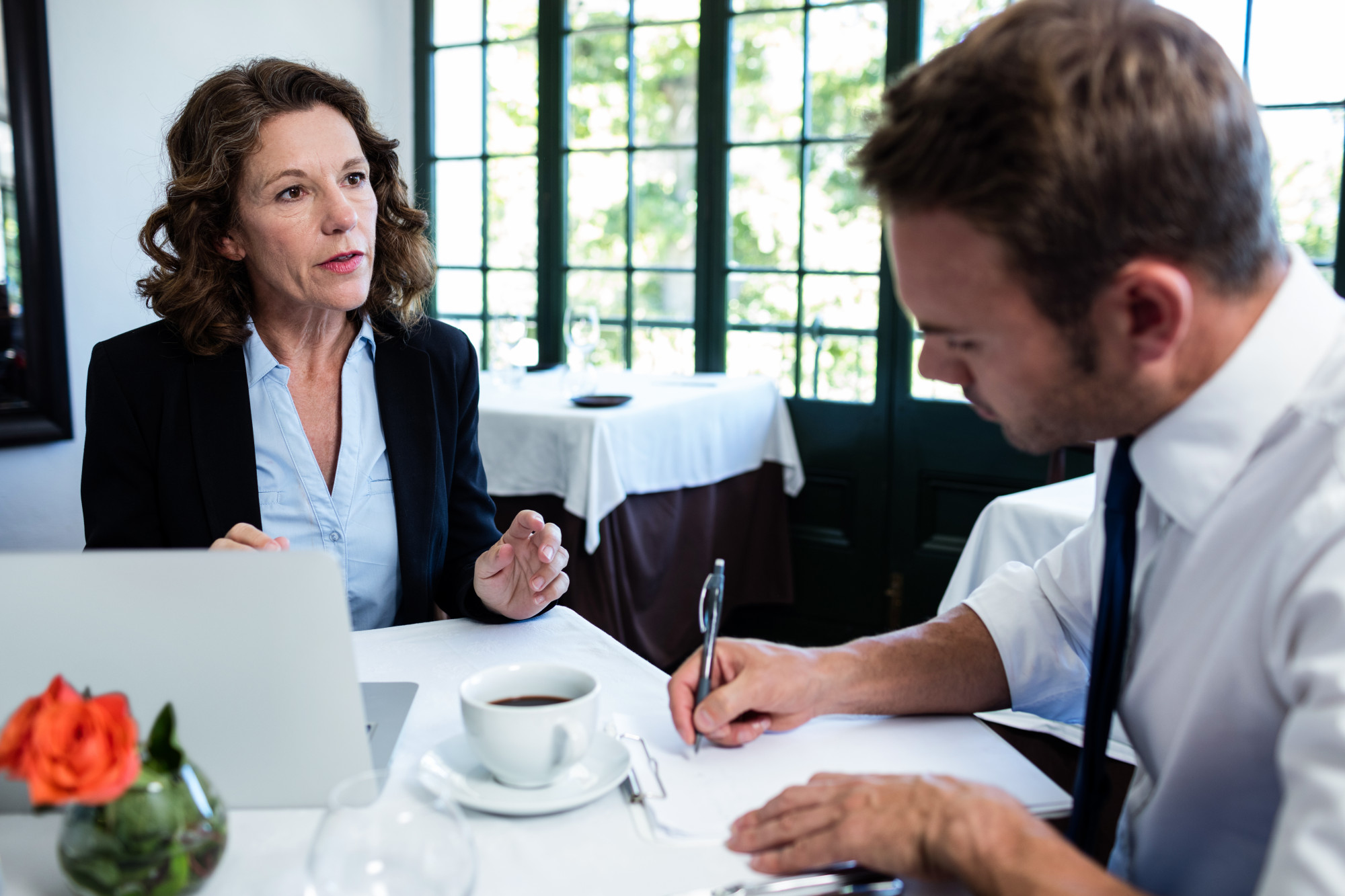 Close-up of attorney explaining spousal support options to client.