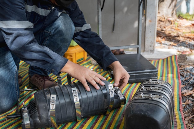 Plumber operating sewer camera inspection tool.