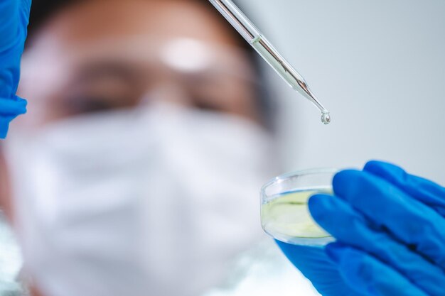 Scientist examining gut microbiome test results on digital screen in modern lab.