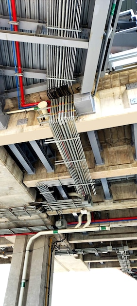 New plumbing and ventilation pipes being installed in apartment structure.