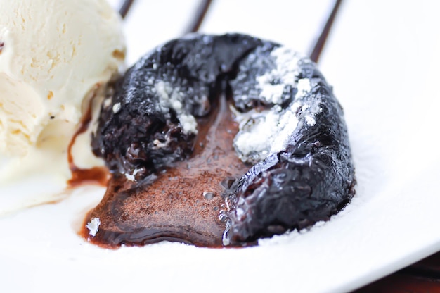 Rising chocolate soufflé with melting ice cream.