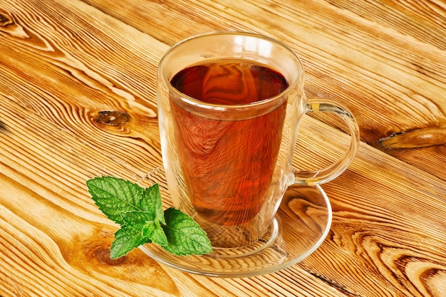 Glass of aromatic mint tea with herbs.