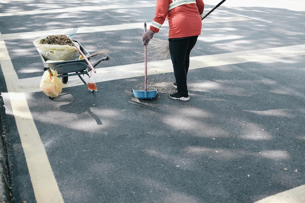 Expert applying protective sealant to residential driveway surface