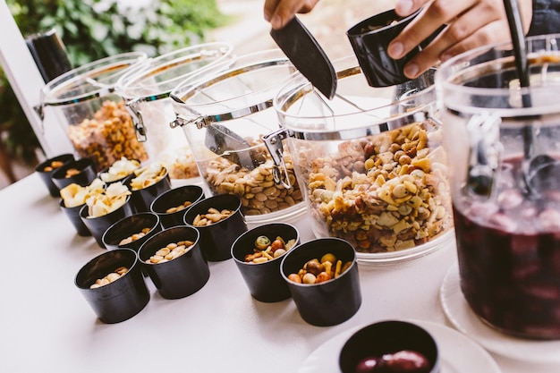 Catering buffet setup featuring fresh food and beverages for event participants.