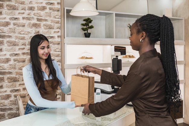 Customer dropping off a package at the shipping counter.