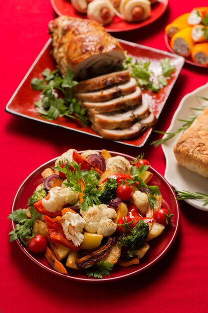 Layered chicken garnachas garnished with fresh avocado and sauce.