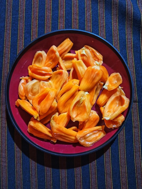 Crispy yuca frita garnished with fresh slaw.