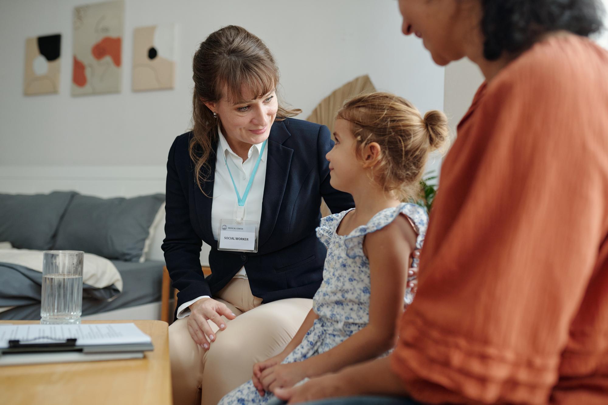 Family law attorney reviewing custody documents with concerned parents.