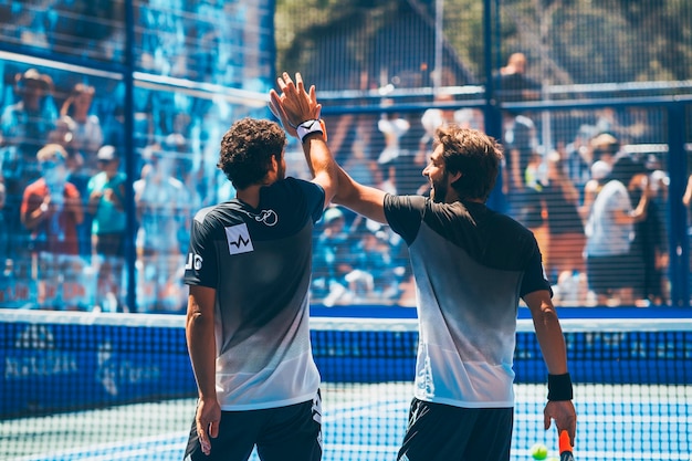 High-energy padel tournament in progress.