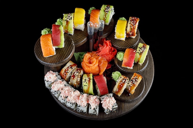 Assorted specialty sushi rolls on a decorative platter.
