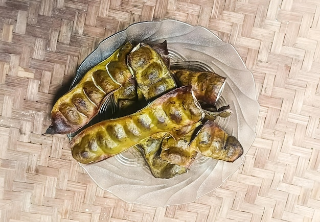 Traditional tamales unwrapped to show filling inside.