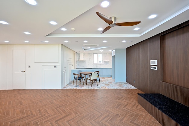 Newly installed stretch ceiling with recessed lights in apartment.