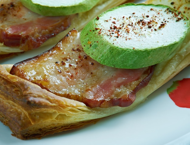 Steaming baleadas filled with beans, cheese, and crema on a rustic plate.