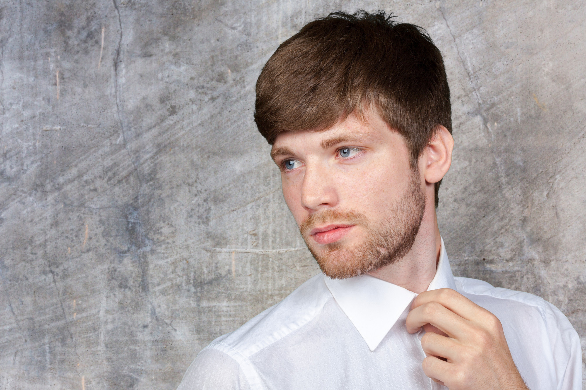Close-up of a neat crew cut hairstyle featuring short sides and textured top.