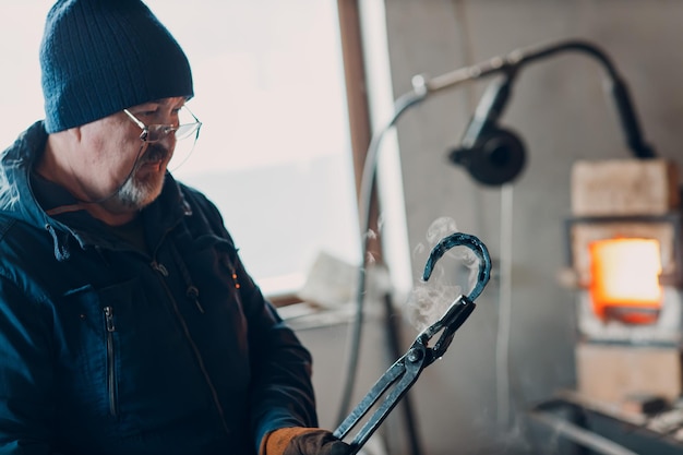 Technician applying heat to frozen plumbing pipes.