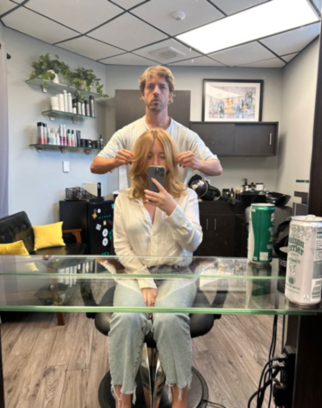 Stylist Luke working on a client's hair in his Miami studio, showcasing his precision cutting and styling expertise.