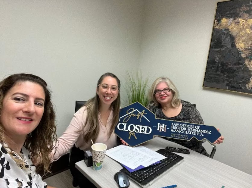 Client celebrating a successful real estate closing with our team